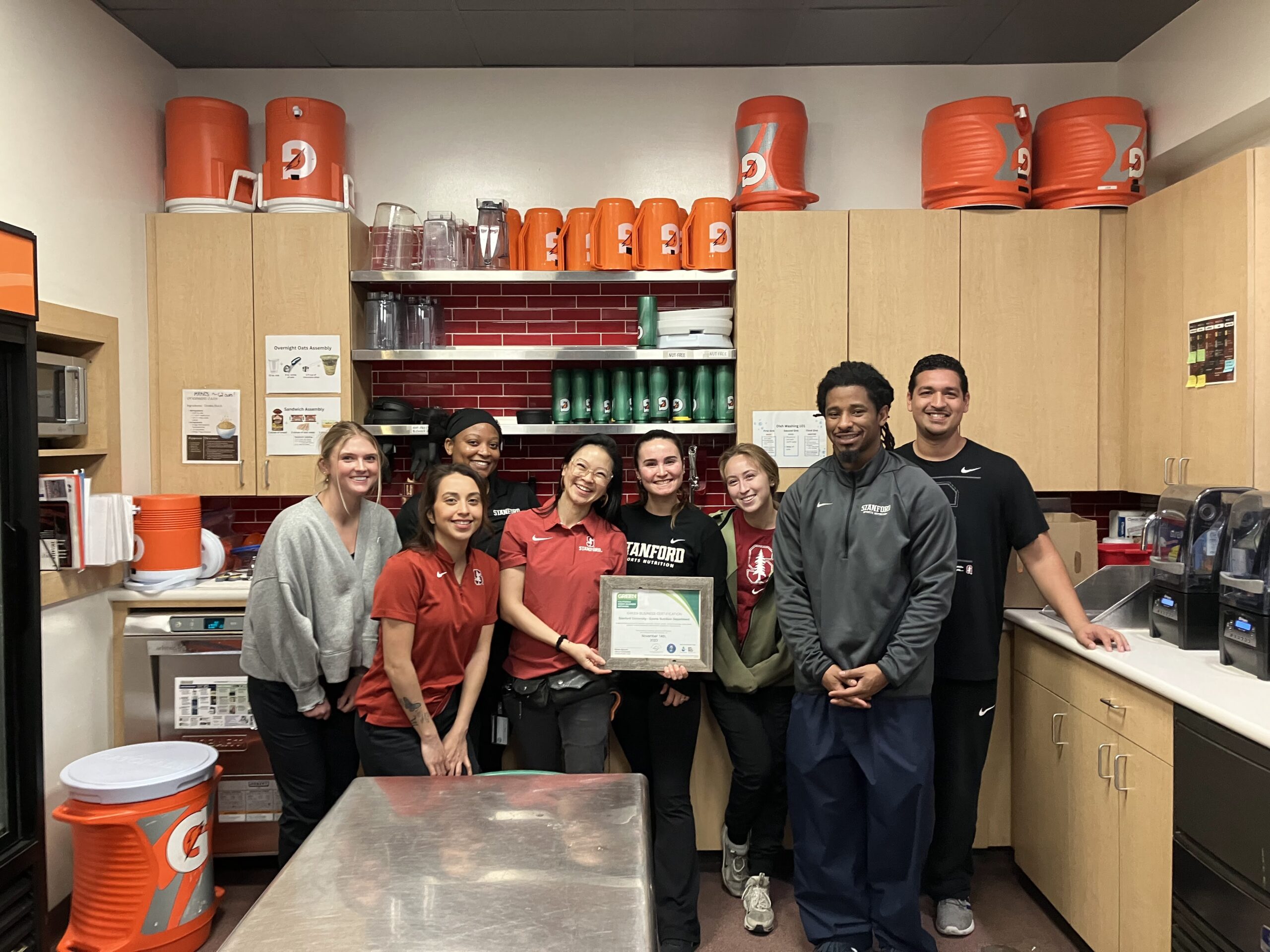 Students posing with a an award