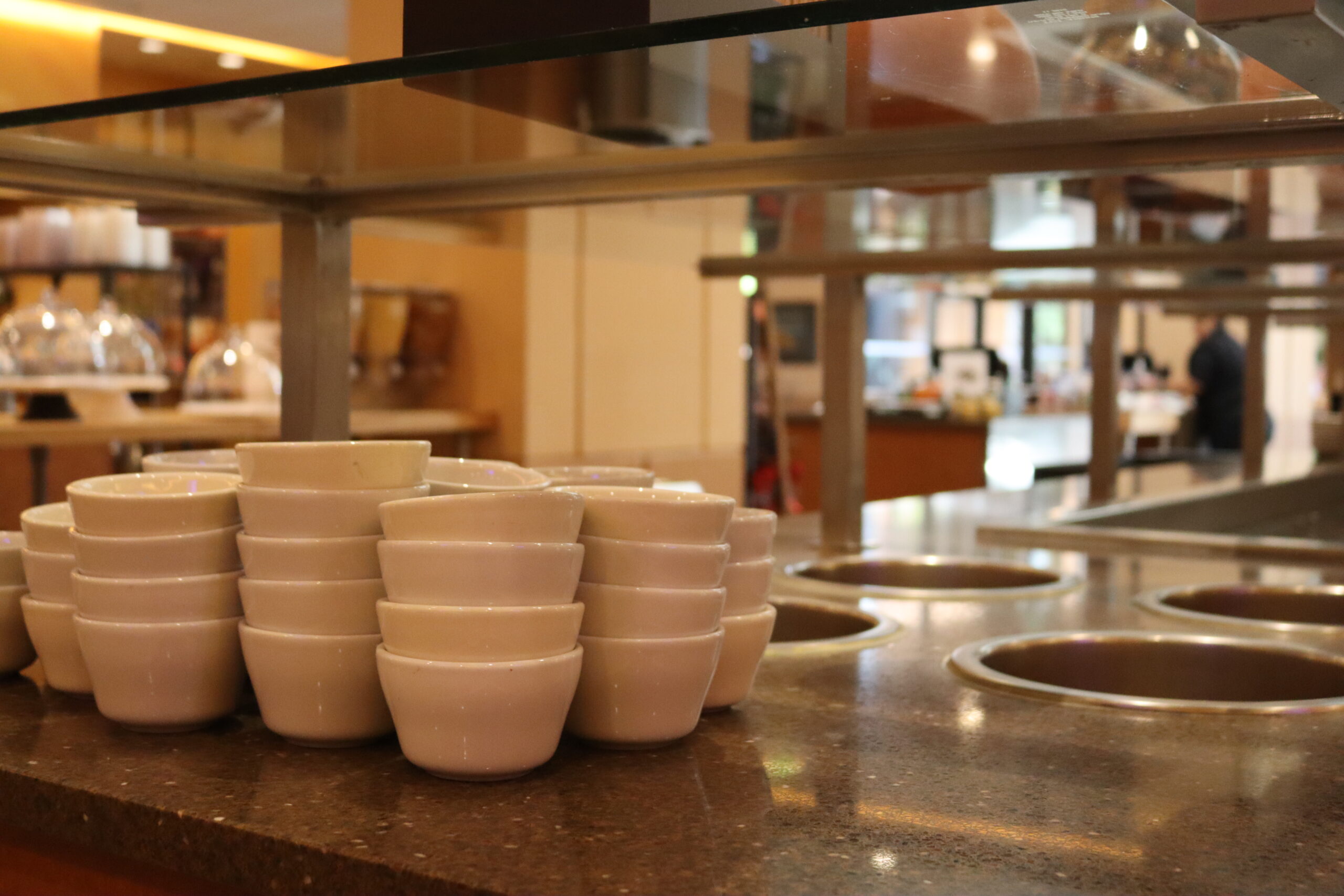 Stacks of reusable bowls in a dining hall