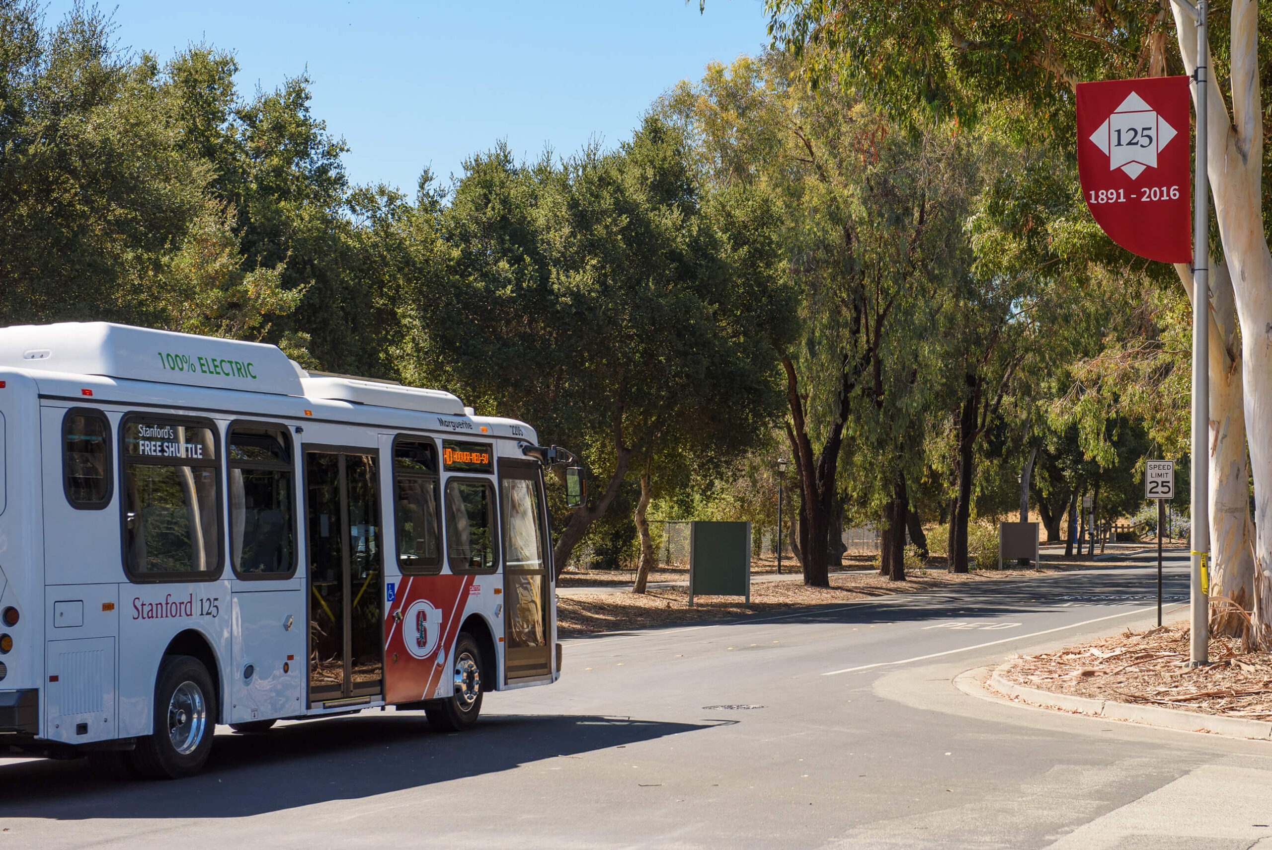 Electric bus driving on campus