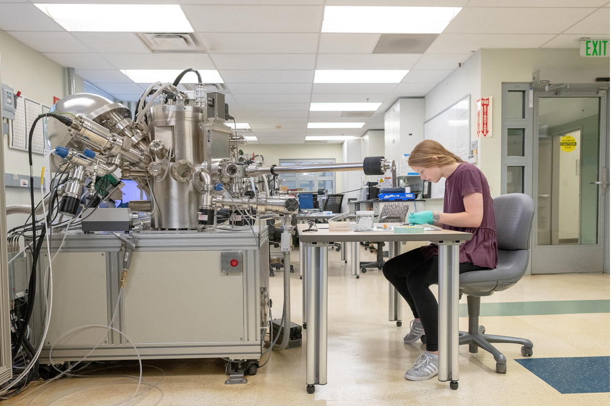 Researcher working in a lab wearing gloves
