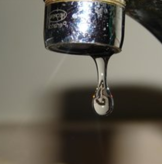 Close up of leaking faucet
