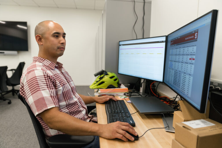 Building Manager working on 2 computer monitors