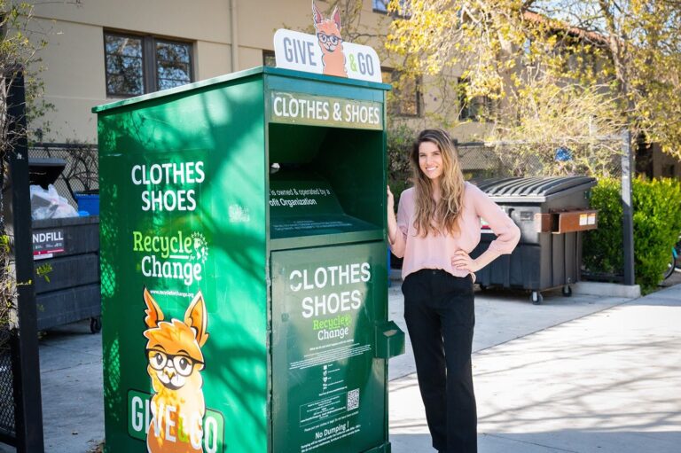 Student next to a green Give & Go donation bin