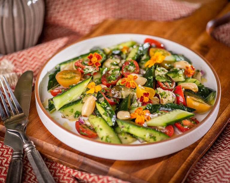 Herbed Persian cucumber salad with heirloom tomatoes and roasted garlic as part of the plant-based menu in Stanford Dinning.
