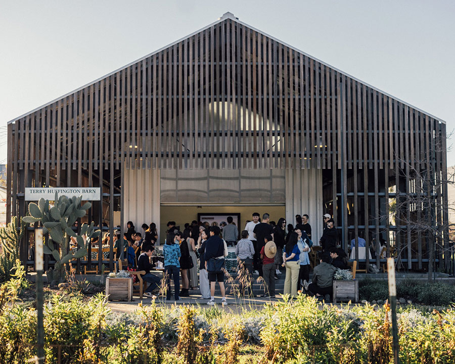 Students mingle in the Terry Huffington Barn, which features a unique cedar slat exterior that allows for with abundant light and fresh air.