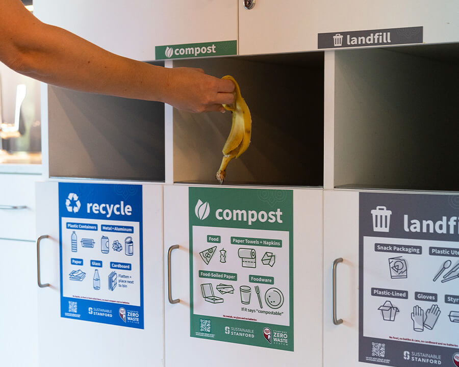 Someone throwing banana in compost bin