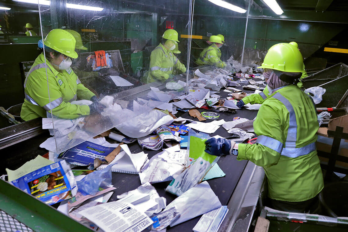 Group of workers in hardhats sorting