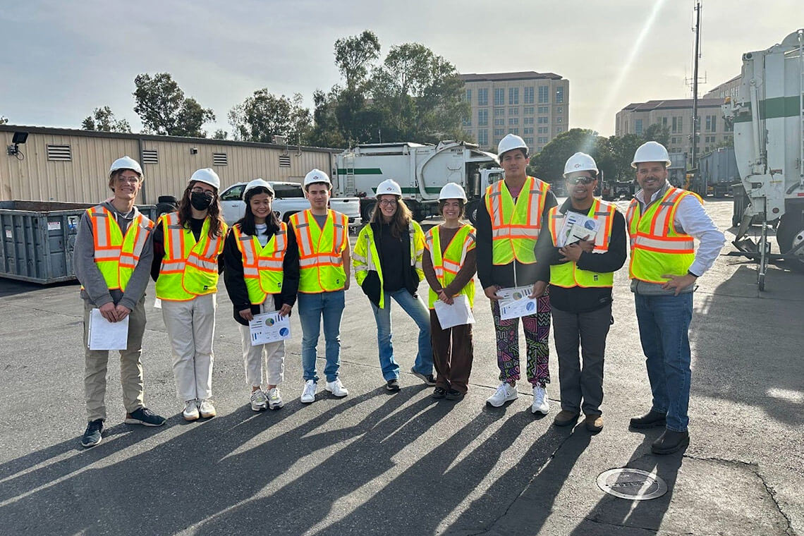 Group of students in hard hats lined up at PSSI