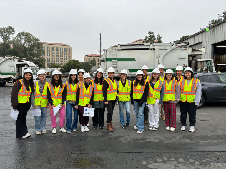 Student intern and fellow group with safety vests at PSSI yard