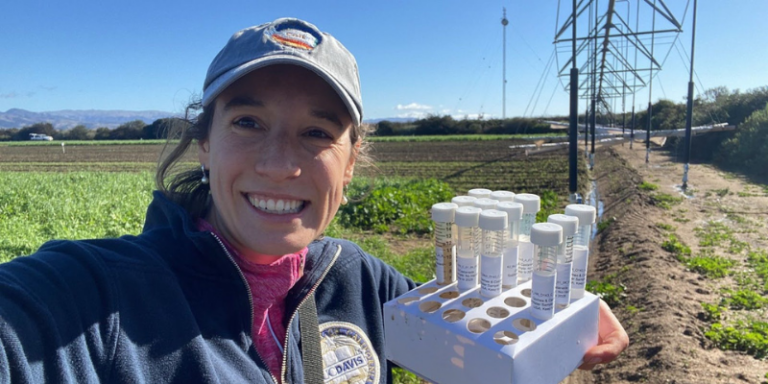 Anna Gomes, PhD Candidate in Earth System Science, in the field gathering soil samples to support her research on sustainable agriculture.