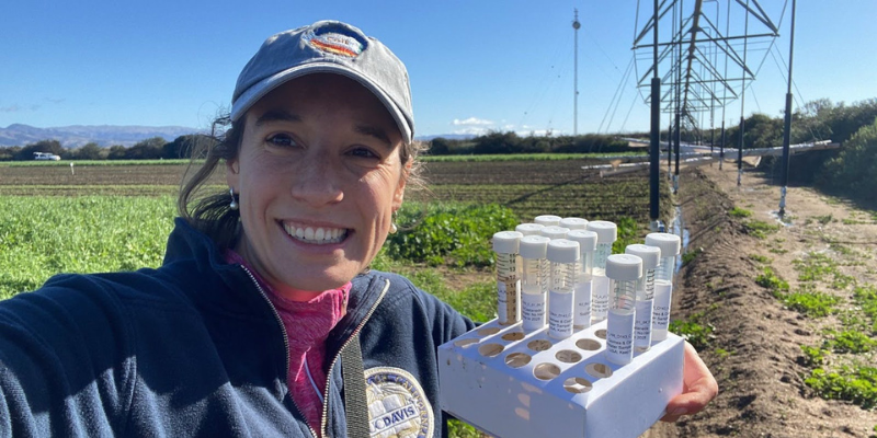 Anna Gomes, PhD Candidate in Earth System Science, in the field gathering soil samples to support her research on sustainable agriculture.