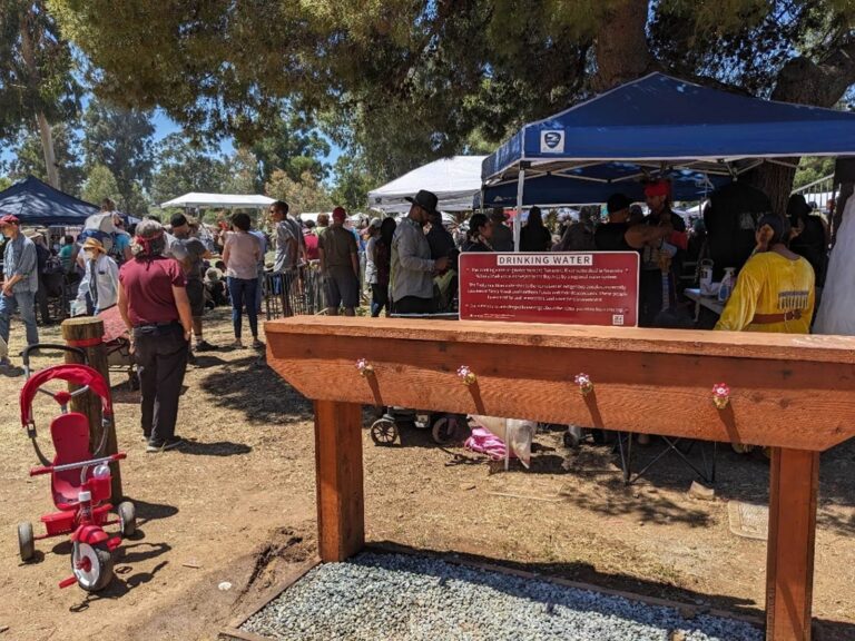 Community Powwow event at Stanford campus with new signs for water bottle filling stations
